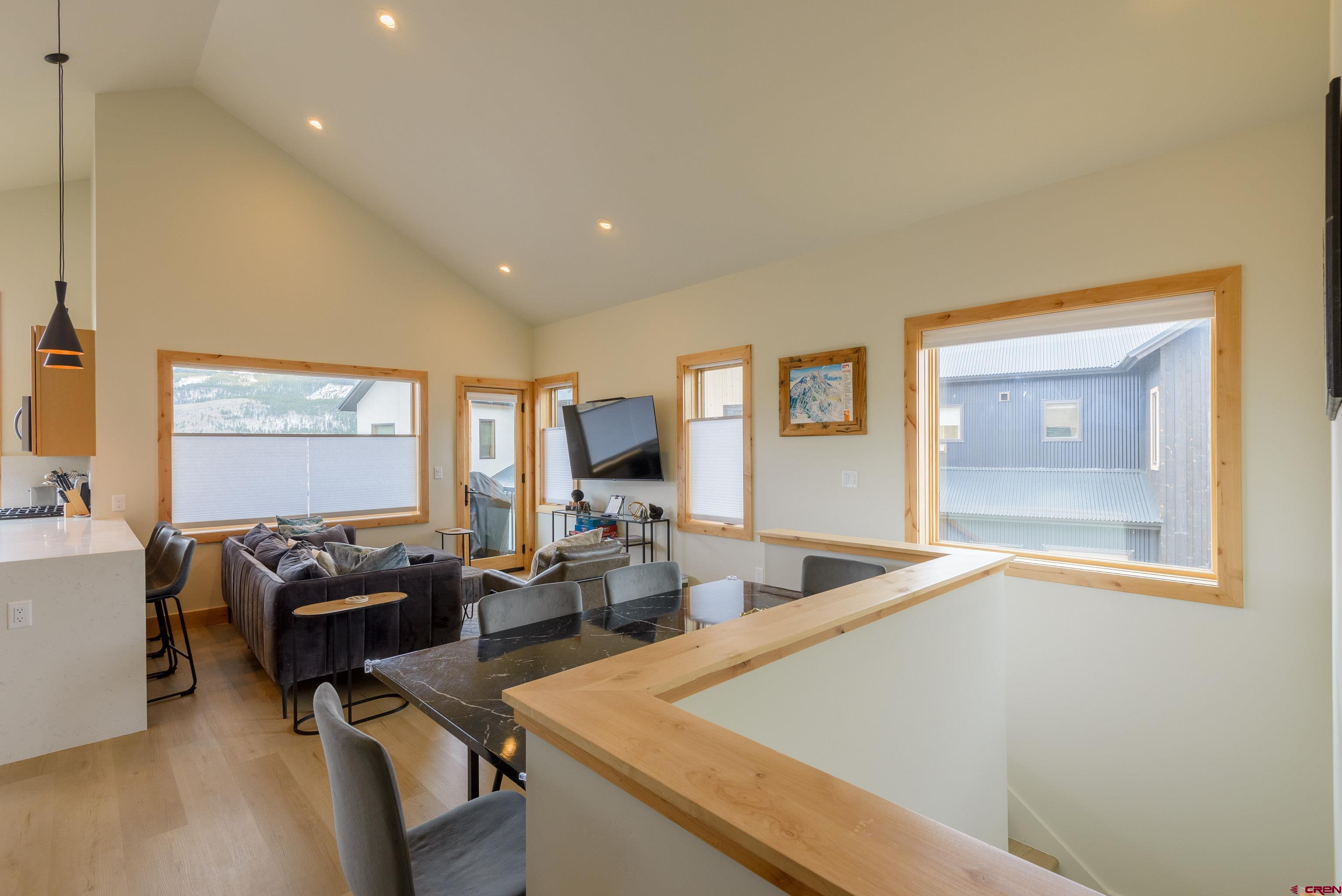 131 Elk Valley Road, Unit A Crested Butte, CO 81224 - Photo 6 of 29 a living room with furniture window and wooden floor