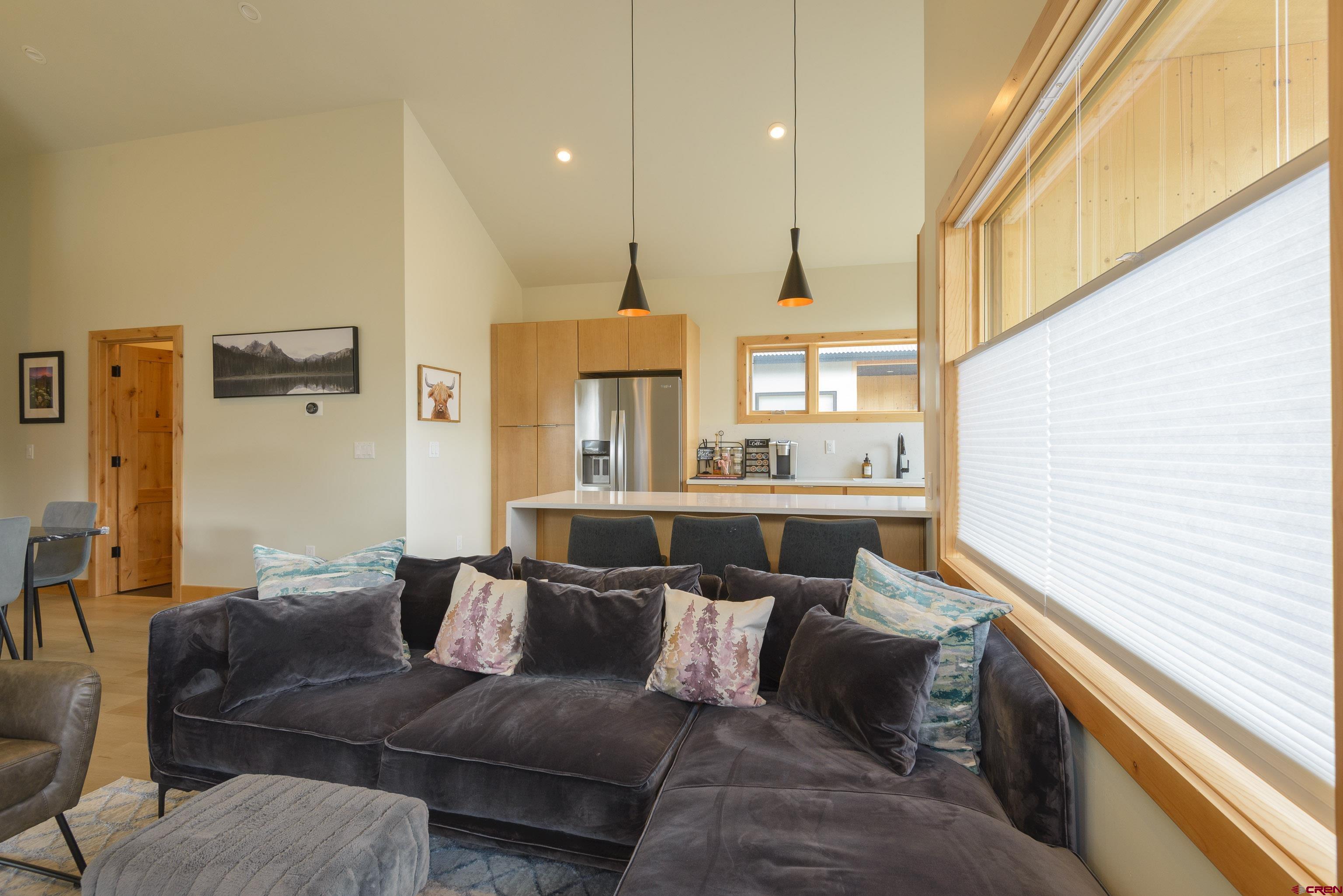 131 Elk Valley Road, Unit A Crested Butte, CO 81224 - Photo 7 of 29 a living room with furniture and a large window