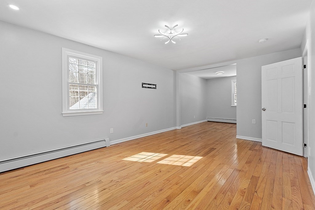 11 Boucher Road Lunenburg, MA 01462 - Photo 21 of 34 a view of empty room with wooden floor and fan