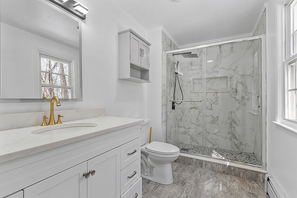 11 Boucher Road Lunenburg, MA 01462 - Photo 23 of 34 a bathroom with a sink a toilet and shower