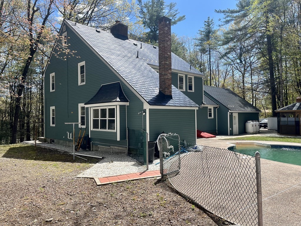 11 Boucher Road Lunenburg, MA 01462 - Photo 4 of 34 a front view of a house with garden and trees