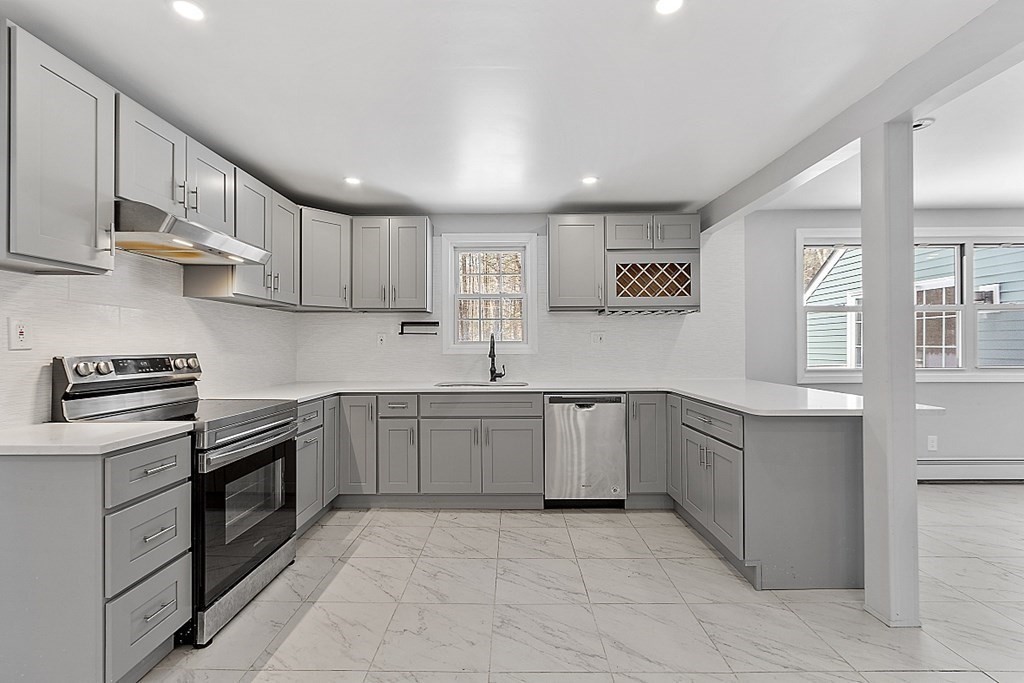 11 Boucher Road Lunenburg, MA 01462 - Photo 7 of 34 a kitchen with granite countertop a sink and cabinets