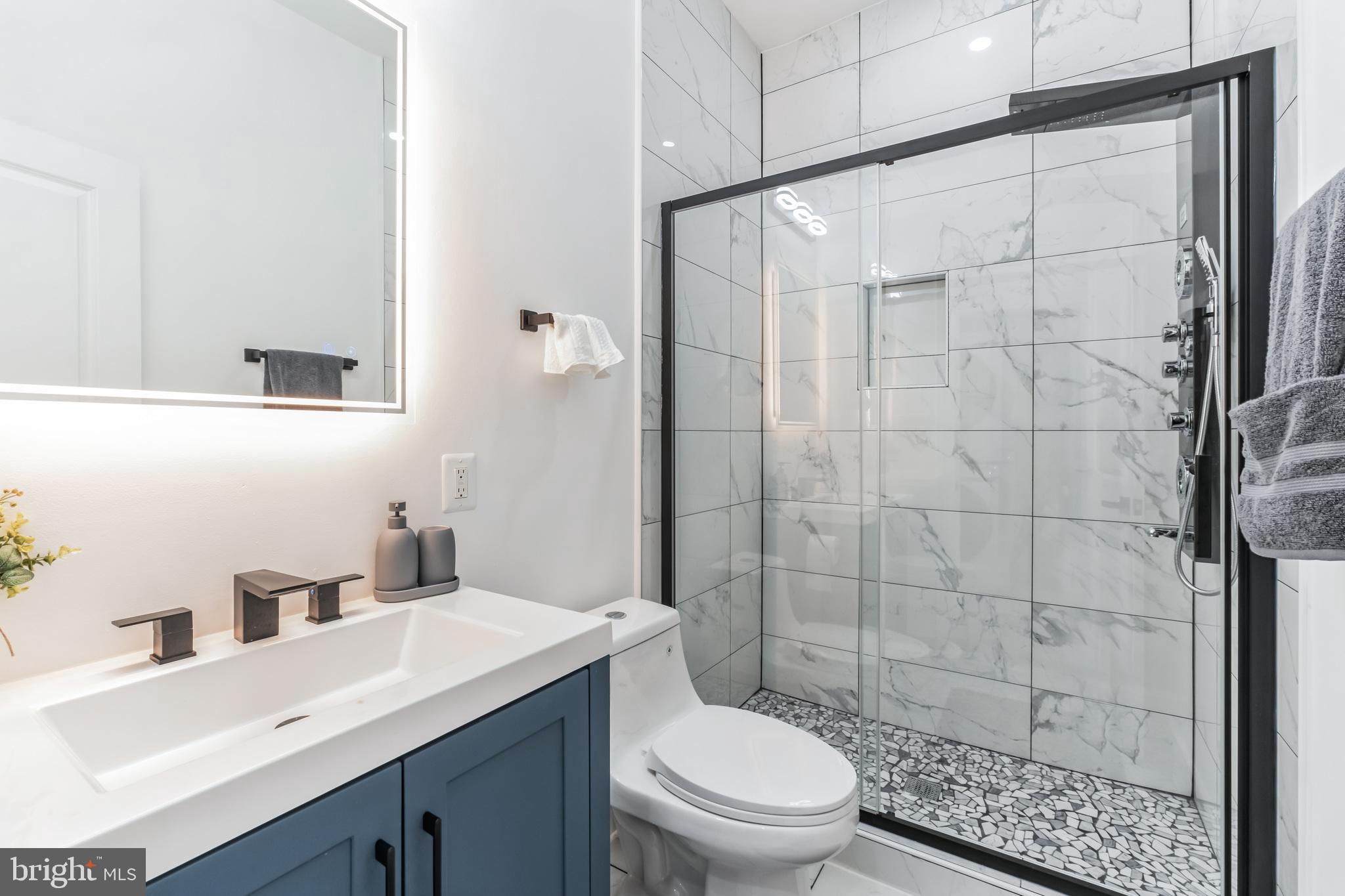 33 Florida Avenue Northeast, Unit 3 Washington, DC 20002 - Photo 10 of 15 a bathroom with a sink a toilet and shower
