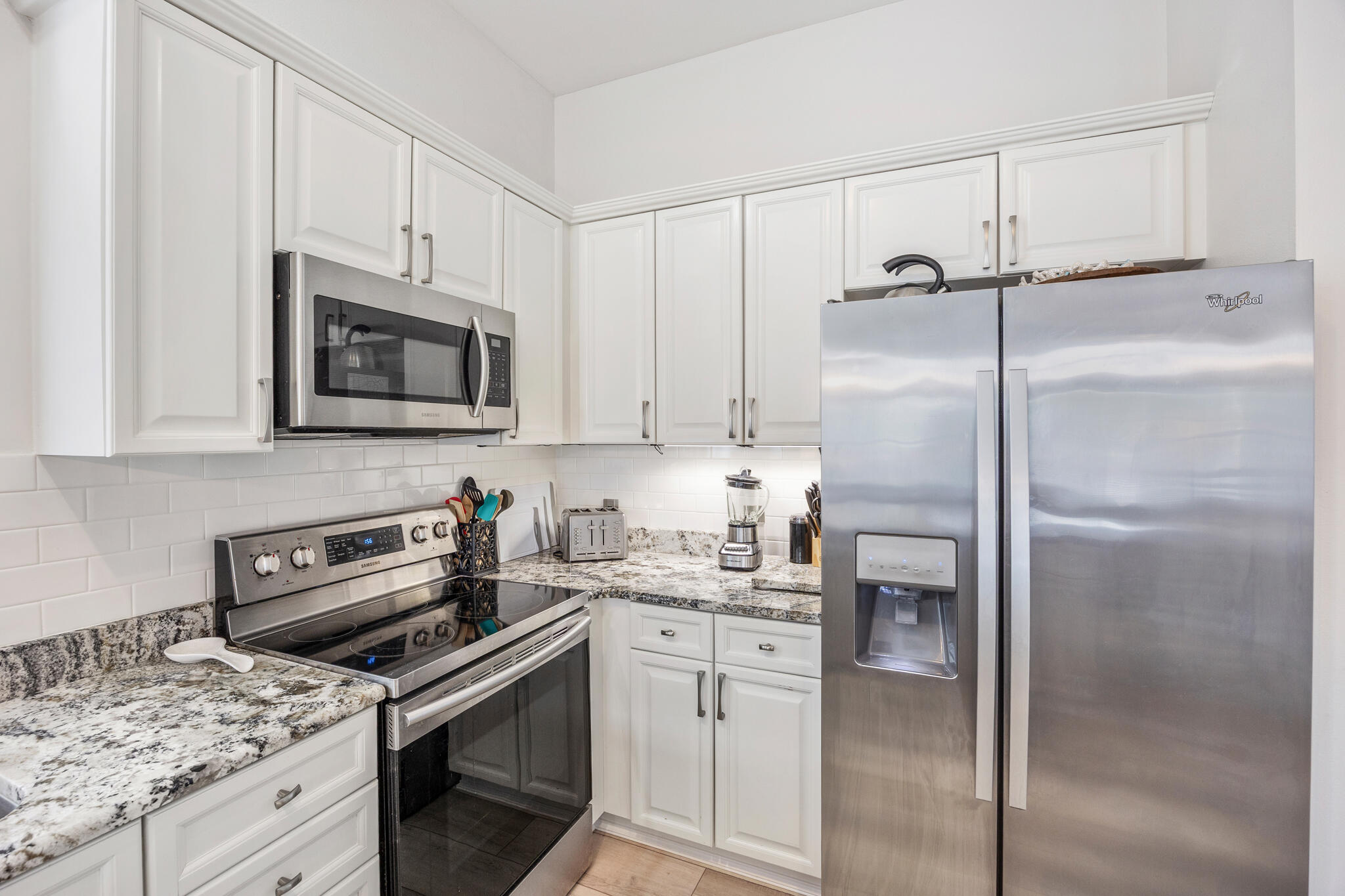 233 Redfish Circle Santa Rosa Beach, FL 32459 - Photo 14 of 73 a kitchen with stainless steel appliances granite countertop a refrigerator stove and sink