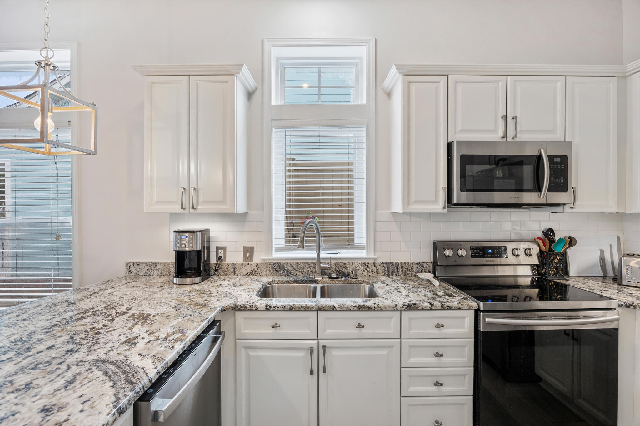 233 Redfish Circle Santa Rosa Beach, FL 32459 - Photo 15 of 73 a kitchen with sink cabinets and microwave
