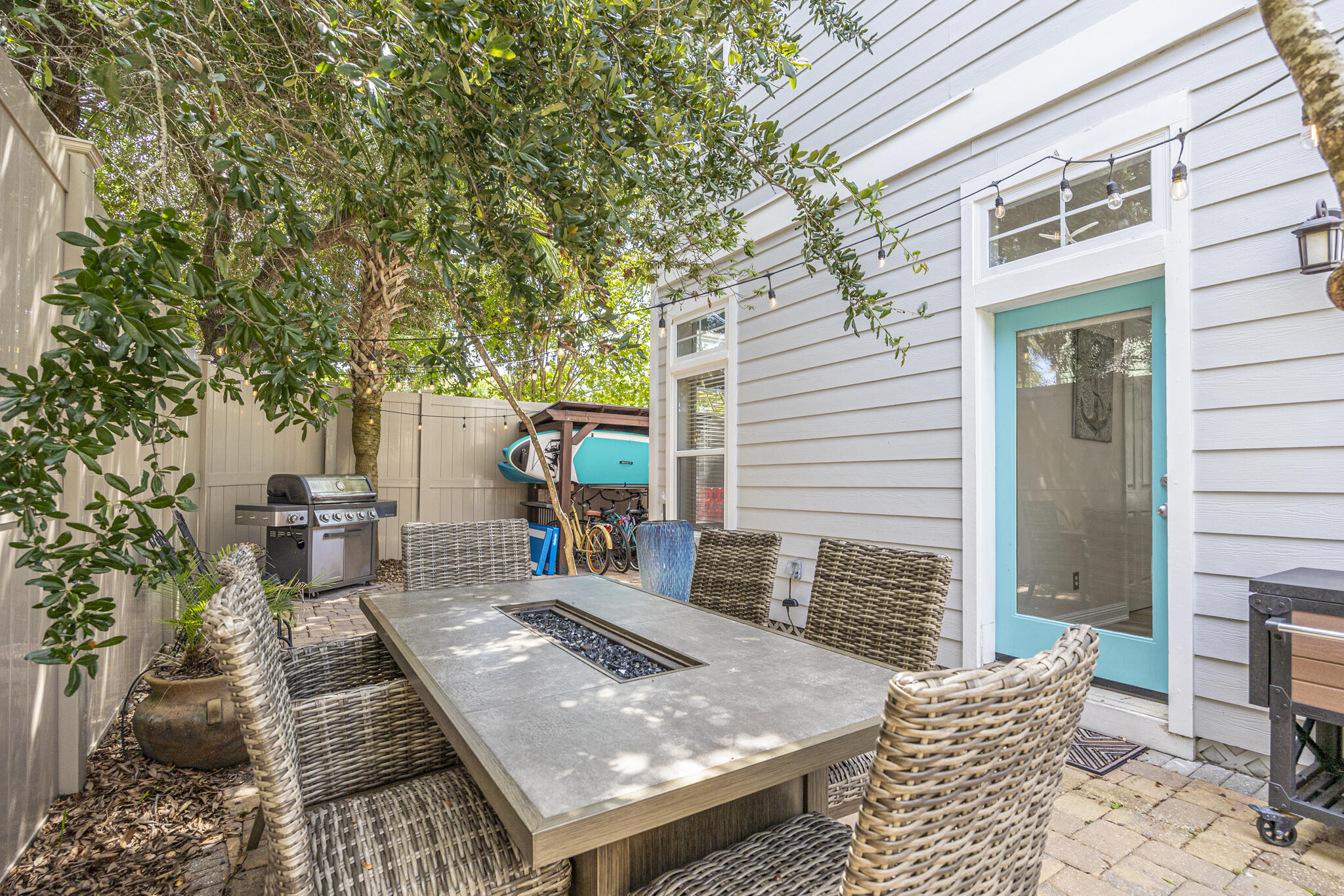 233 Redfish Circle Santa Rosa Beach, FL 32459 - Photo 17 of 73 front view of a house with a chairs and table in a patio