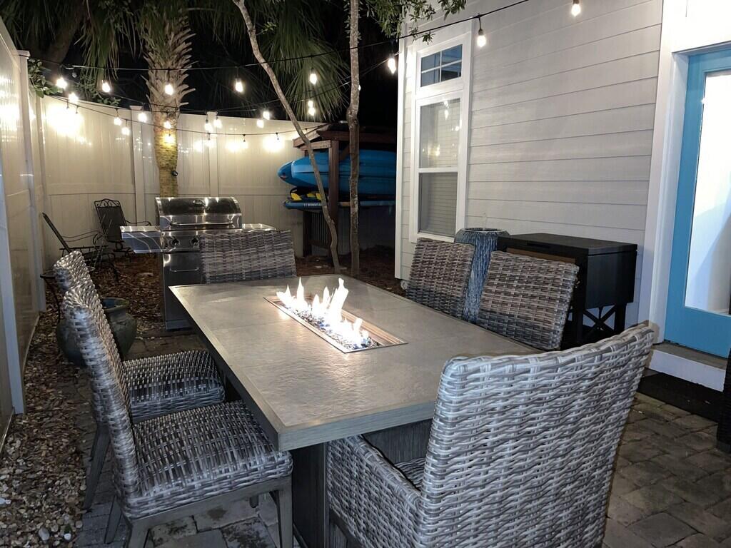 233 Redfish Circle Santa Rosa Beach, FL 32459 - Photo 18 of 73 a dining room with furniture and a chandelier