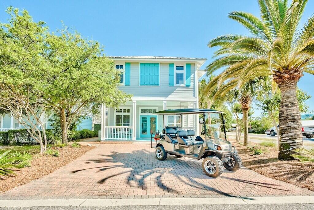 233 Redfish Circle Santa Rosa Beach, FL 32459 - Photo 2 of 73 a view of a patio with a table and chairs and potted plants