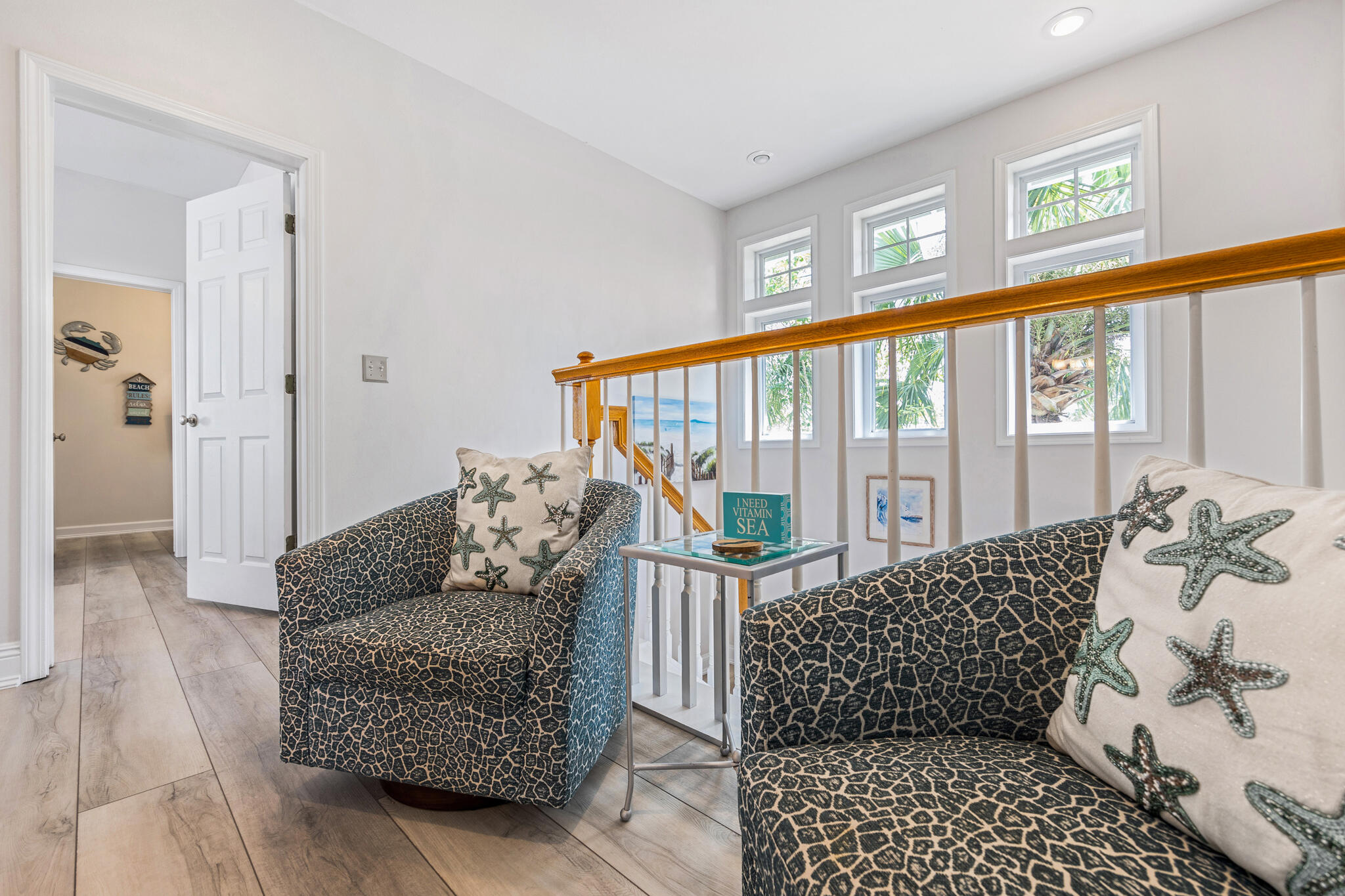 233 Redfish Circle Santa Rosa Beach, FL 32459 - Photo 29 of 73 a living room with furniture and a floor to ceiling window