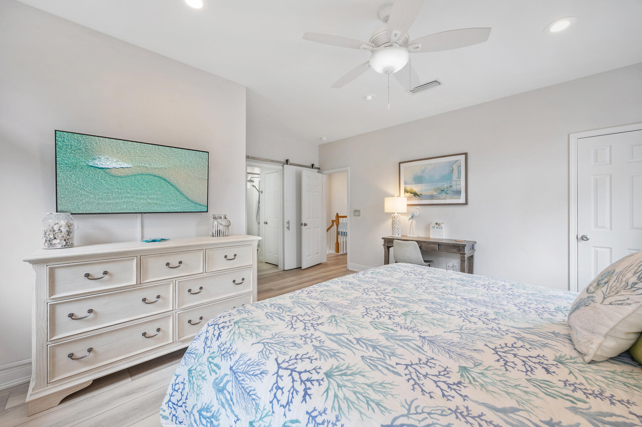 233 Redfish Circle Santa Rosa Beach, FL 32459 - Photo 30 of 73 a bedroom with a large bed and a flat tv screen on dresser