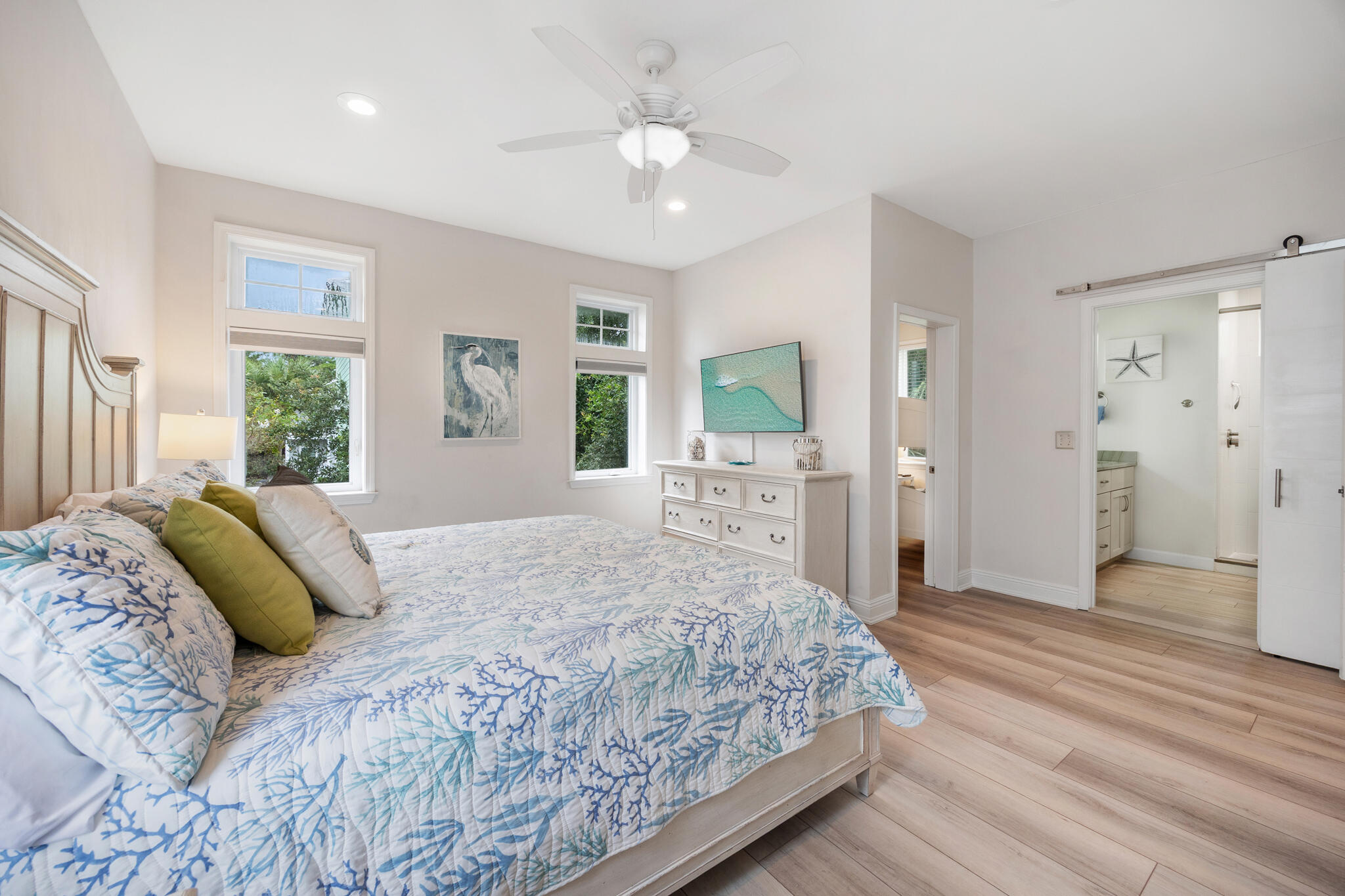 233 Redfish Circle Santa Rosa Beach, FL 32459 - Photo 33 of 73 a bedroom with a large bed and a chandelier