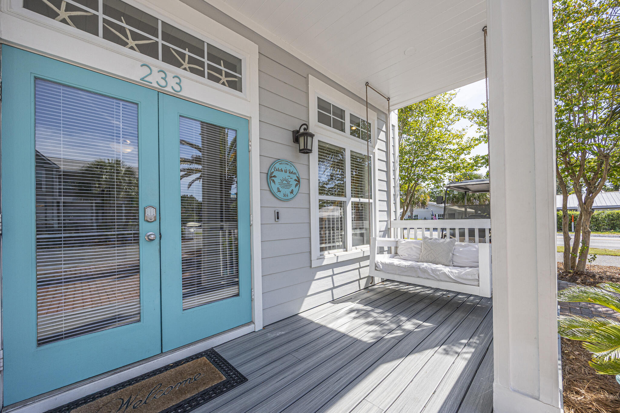 233 Redfish Circle Santa Rosa Beach, FL 32459 - Photo 5 of 73 a view of a balcony with wooden floor