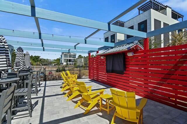233 Redfish Circle Santa Rosa Beach, FL 32459 - Photo 59 of 73 a view of a chairs and table in the patio