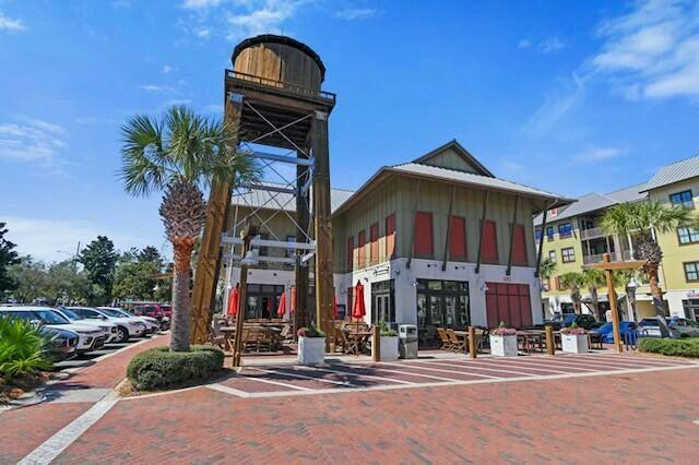 233 Redfish Circle Santa Rosa Beach, FL 32459 - Photo 60 of 73 a view of a brick building next to a yard