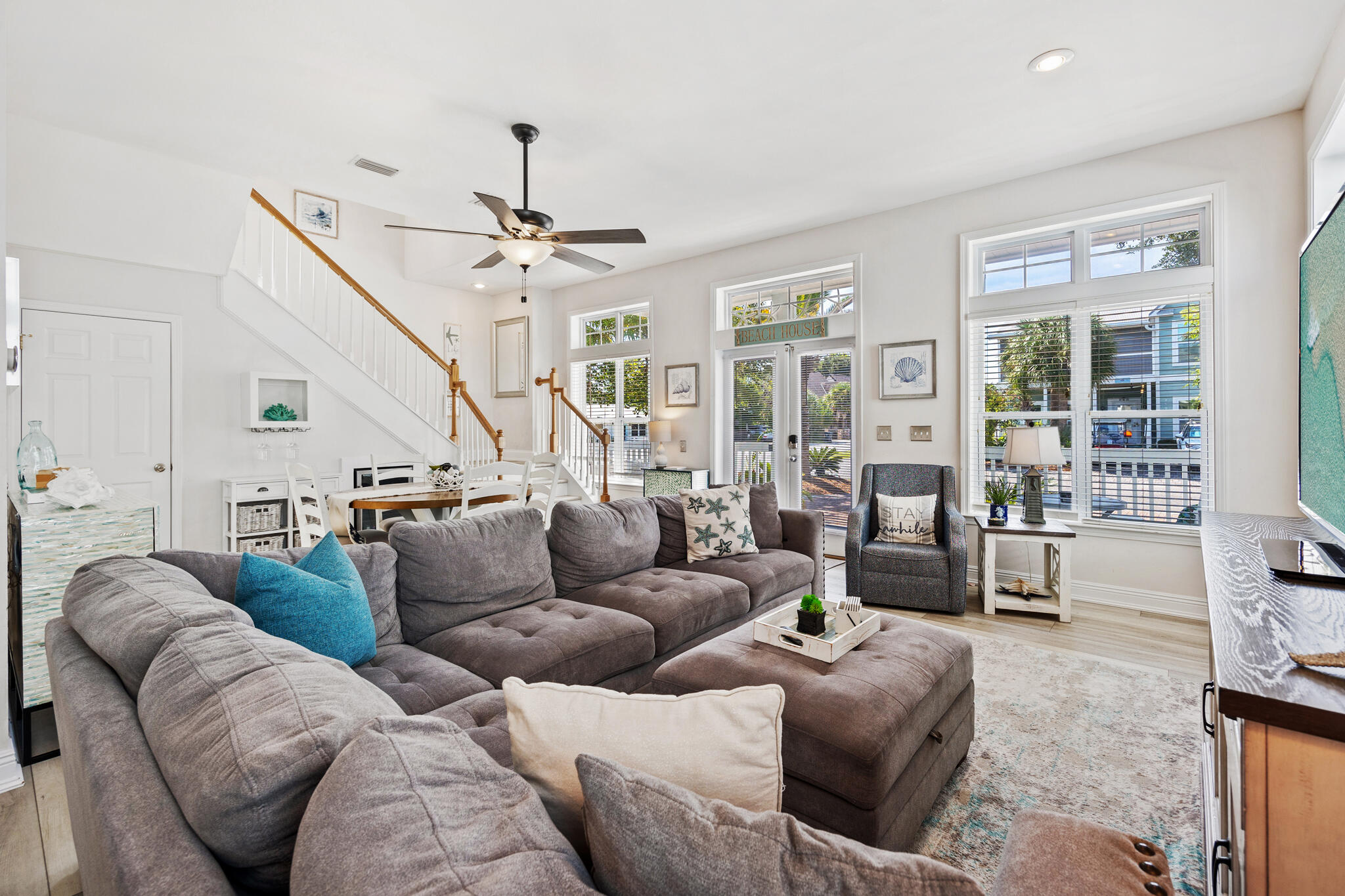 233 Redfish Circle Santa Rosa Beach, FL 32459 - Photo 7 of 73 a living room with furniture ceiling fan and a rug