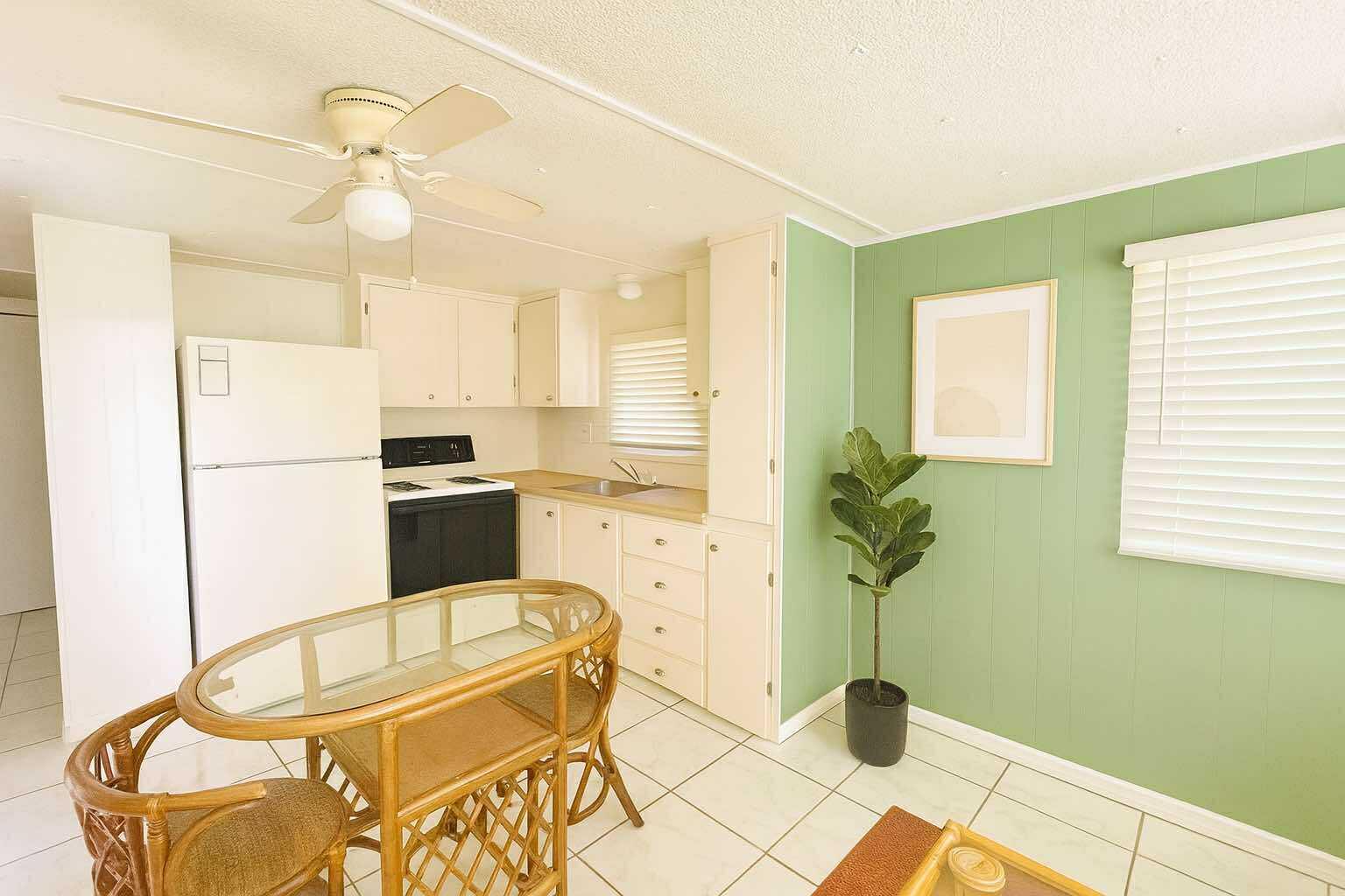 1601 Highway 441, Unit 61 Okeechobee, FL 34974 - Photo 5 of 35 a living room with furniture and a table