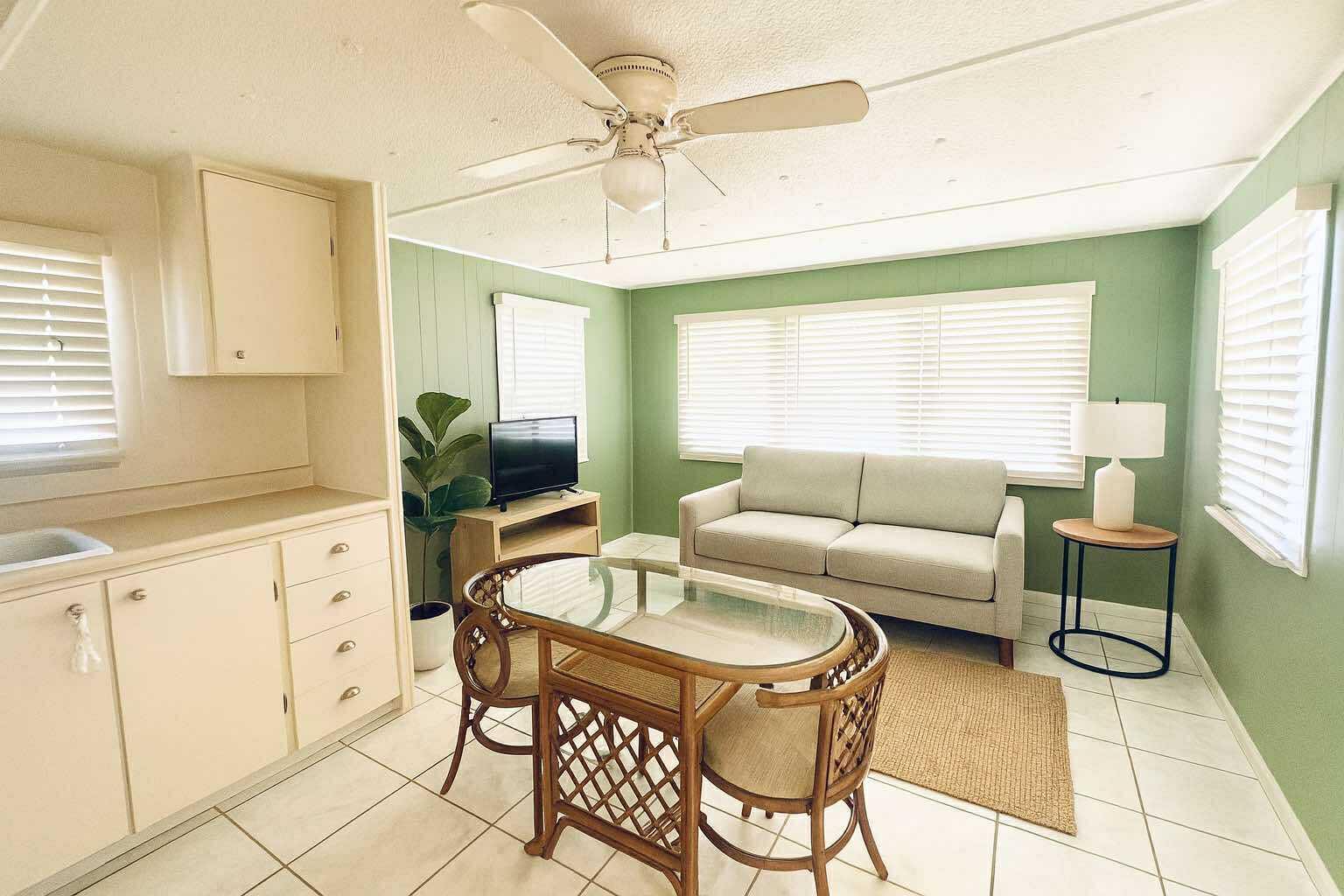 1601 Highway 441, Unit 61 Okeechobee, FL 34974 - Photo 6 of 35 a living room with furniture and a large window