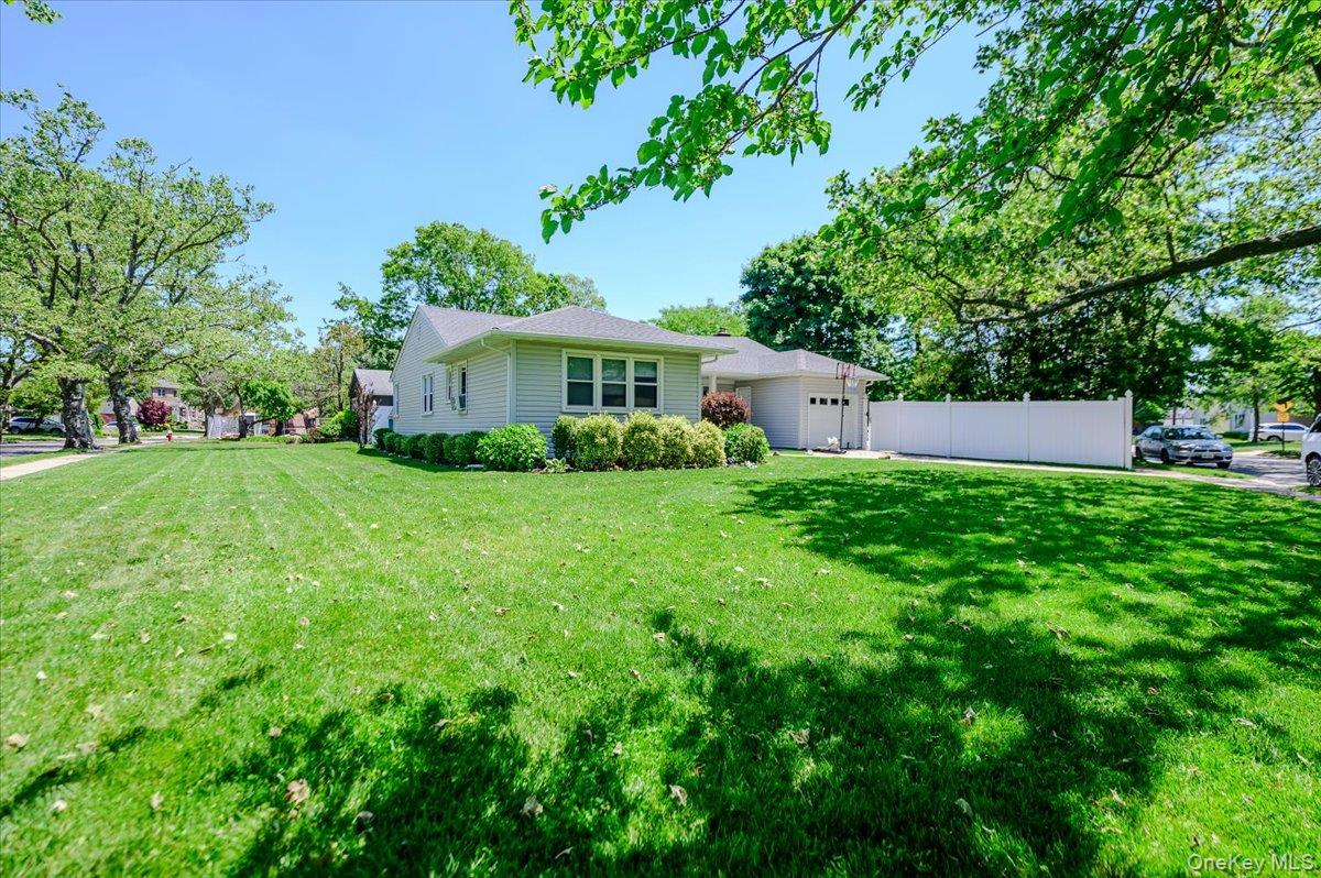 534 Allen Road Woodmere, NY 11598 - Photo 23 of 35 a view of a house with a yard and sitting area