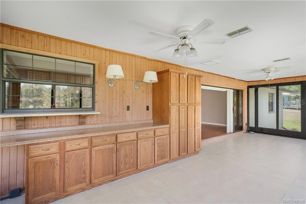 8831 East Sandpiper Drive Inverness, FL 34450 - Photo 16 of 44 a view of an empty room with window and cabinet