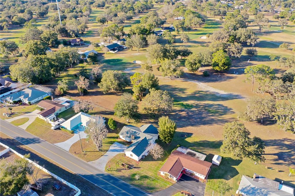 8831 East Sandpiper Drive Inverness, FL 34450 - Photo 36 of 44 an aerial view of residential houses with outdoor space