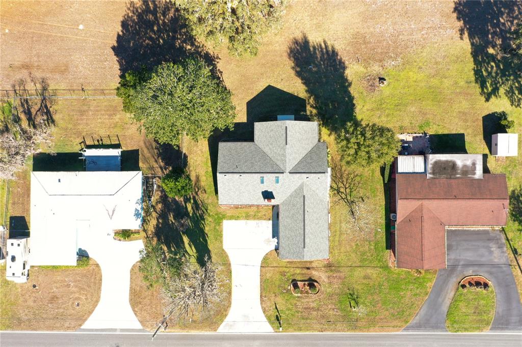 8831 East Sandpiper Drive Inverness, FL 34450 - Photo 41 of 44 an aerial view of a house with a yard