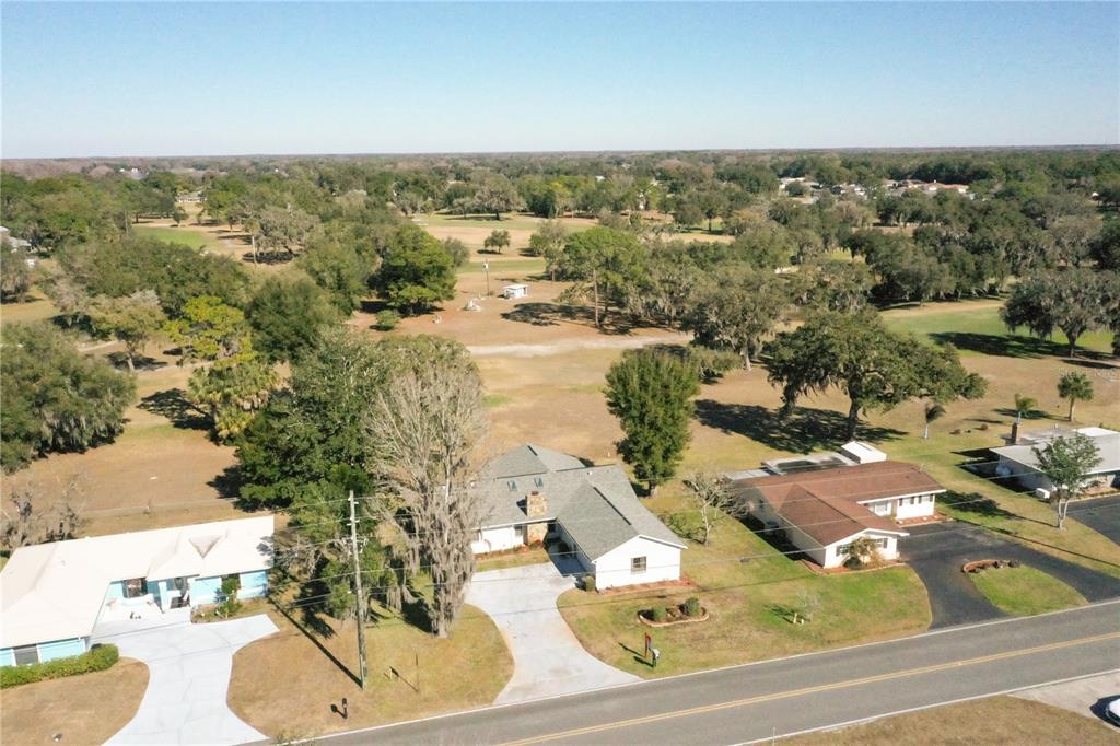 8831 East Sandpiper Drive Inverness, FL 34450 - Photo 42 of 44 an aerial view of residential houses with outdoor space