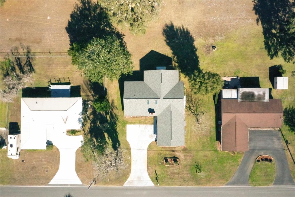 8831 East Sandpiper Drive Inverness, FL 34450 - Photo 43 of 44 an aerial view of a house with a yard