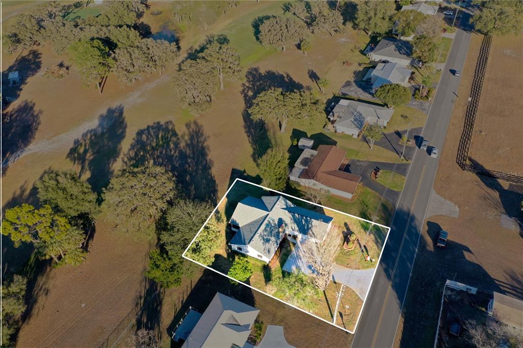 8831 East Sandpiper Drive Inverness, FL 34450 - Photo 44 of 44 an aerial view of a house with a lake