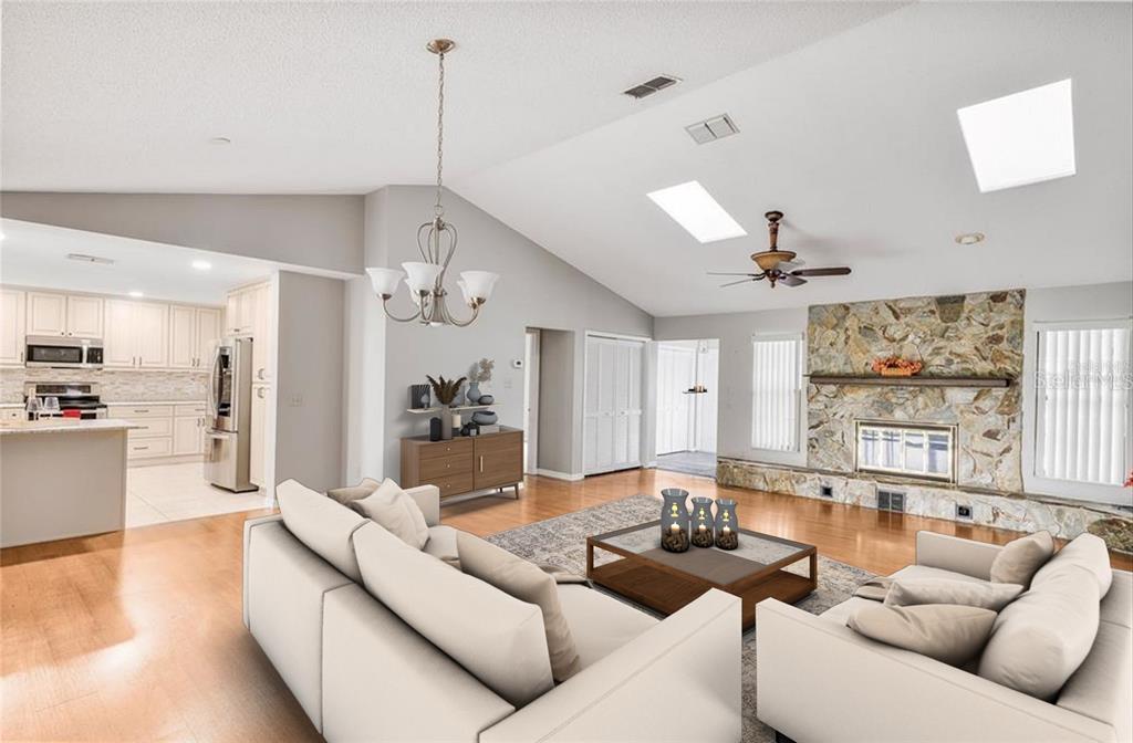8831 East Sandpiper Drive Inverness, FL 34450 - Photo 5 of 44 a living room with furniture kitchen view and a chandelier