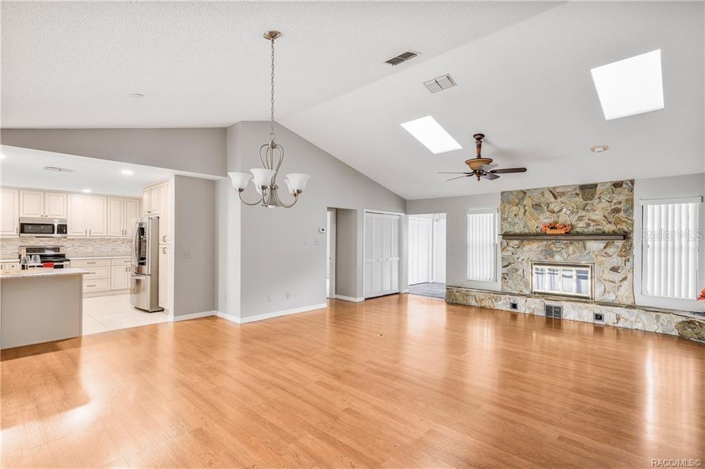 8831 East Sandpiper Drive Inverness, FL 34450 - Photo 6 of 44 a view of an empty room with window and wooden floor