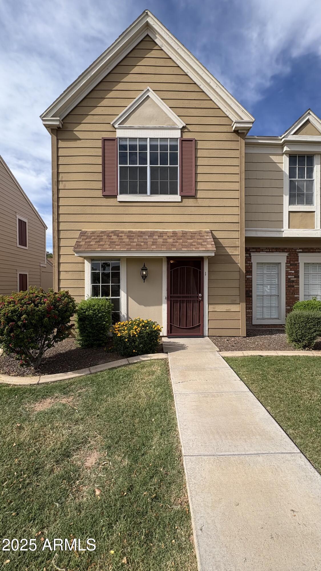 a front view of a house with a yard