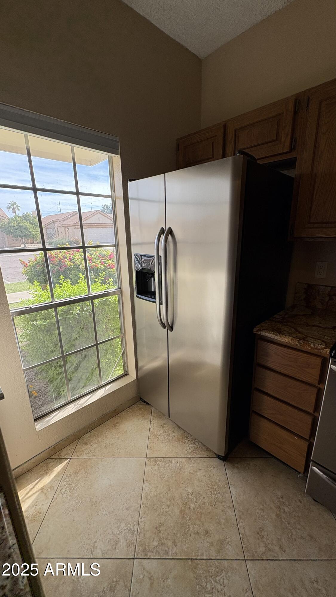 18626 North 33rd Drive, Unit 1 Phoenix, AZ 85027 - Photo 11 of 38 a room with a window and a refrigerator