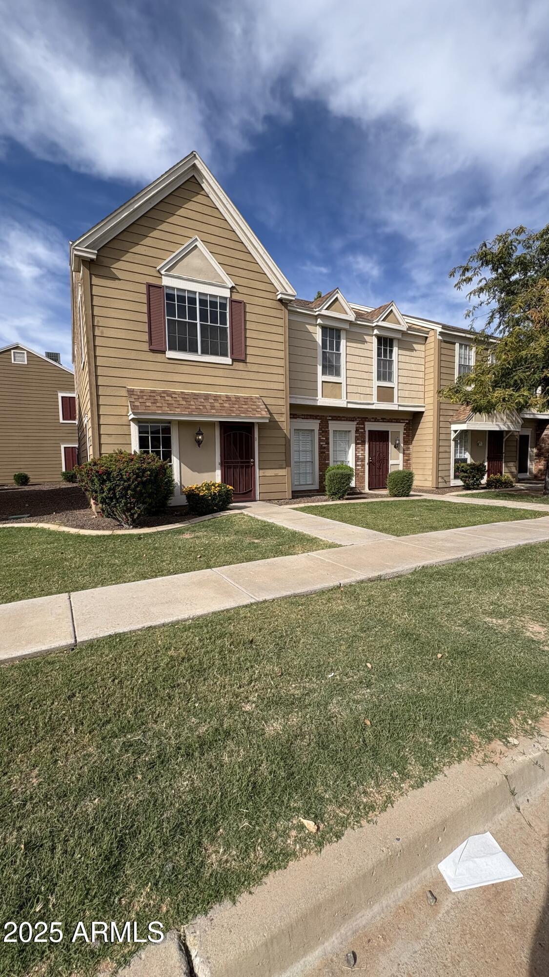 18626 North 33rd Drive, Unit 1 Phoenix, AZ 85027 - Photo 2 of 38 a front view of a house with a yard