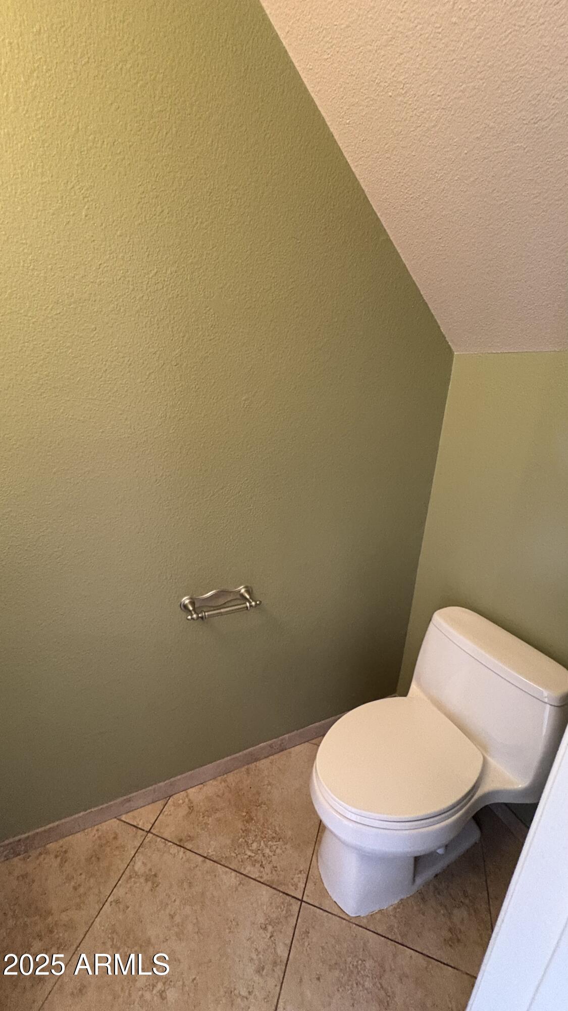 18626 North 33rd Drive, Unit 1 Phoenix, AZ 85027 - Photo 23 of 38 a white toilet sitting next to a white wall