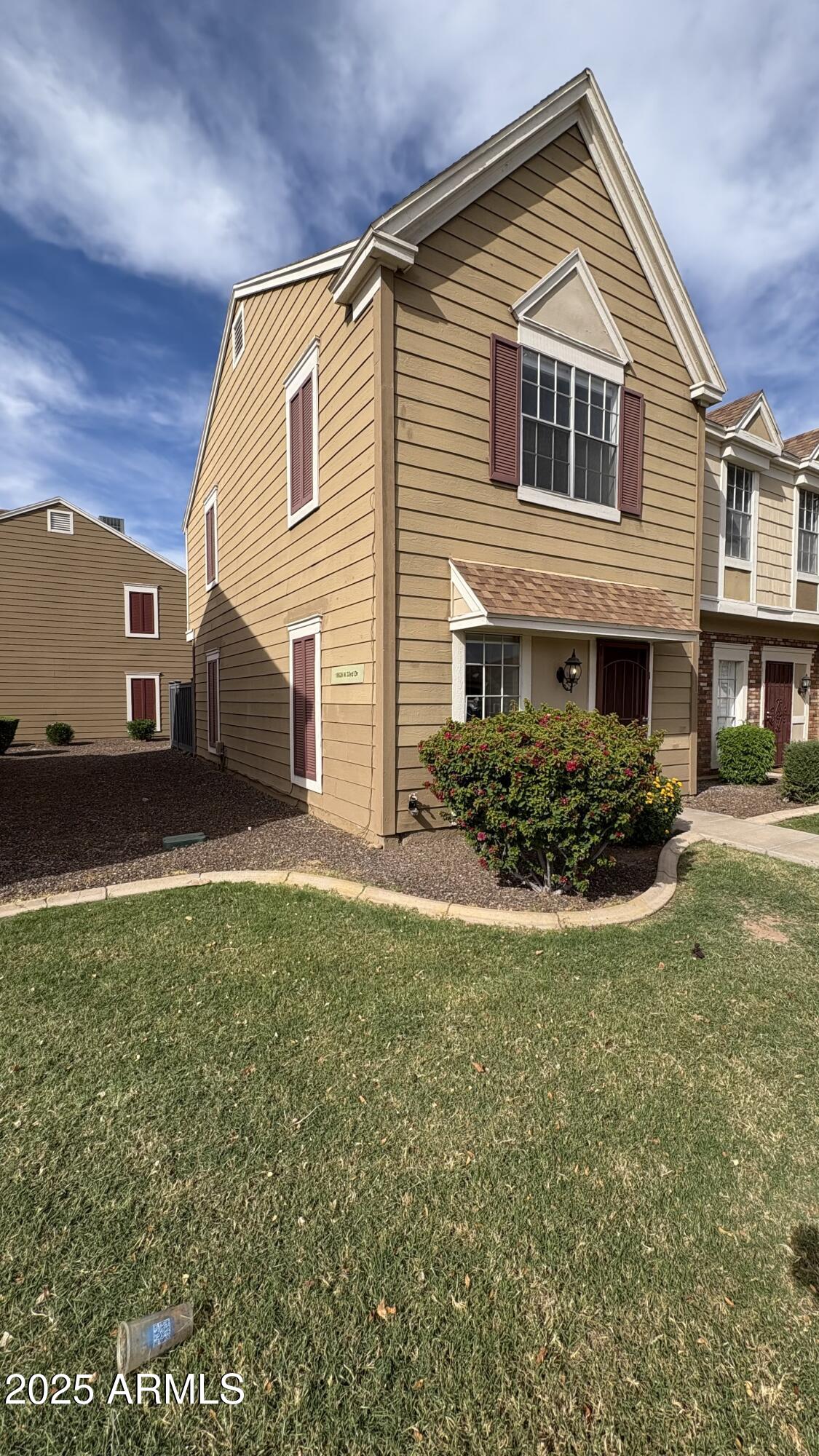 18626 North 33rd Drive, Unit 1 Phoenix, AZ 85027 - Photo 3 of 38 a front view of house with yard