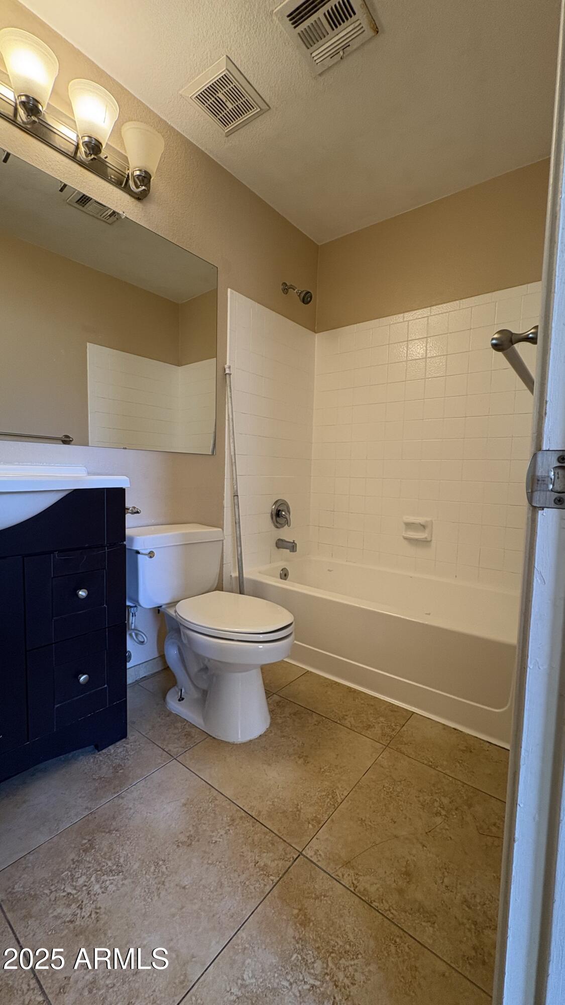 18626 North 33rd Drive, Unit 1 Phoenix, AZ 85027 - Photo 32 of 38 a bathroom with a toilet and a shower