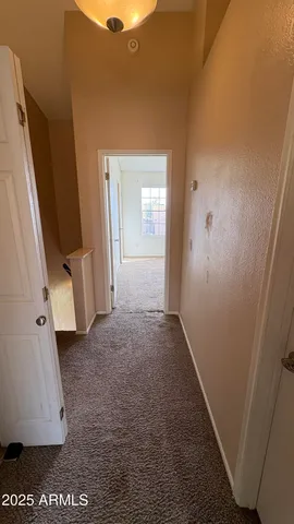 a view of a room with a hallway