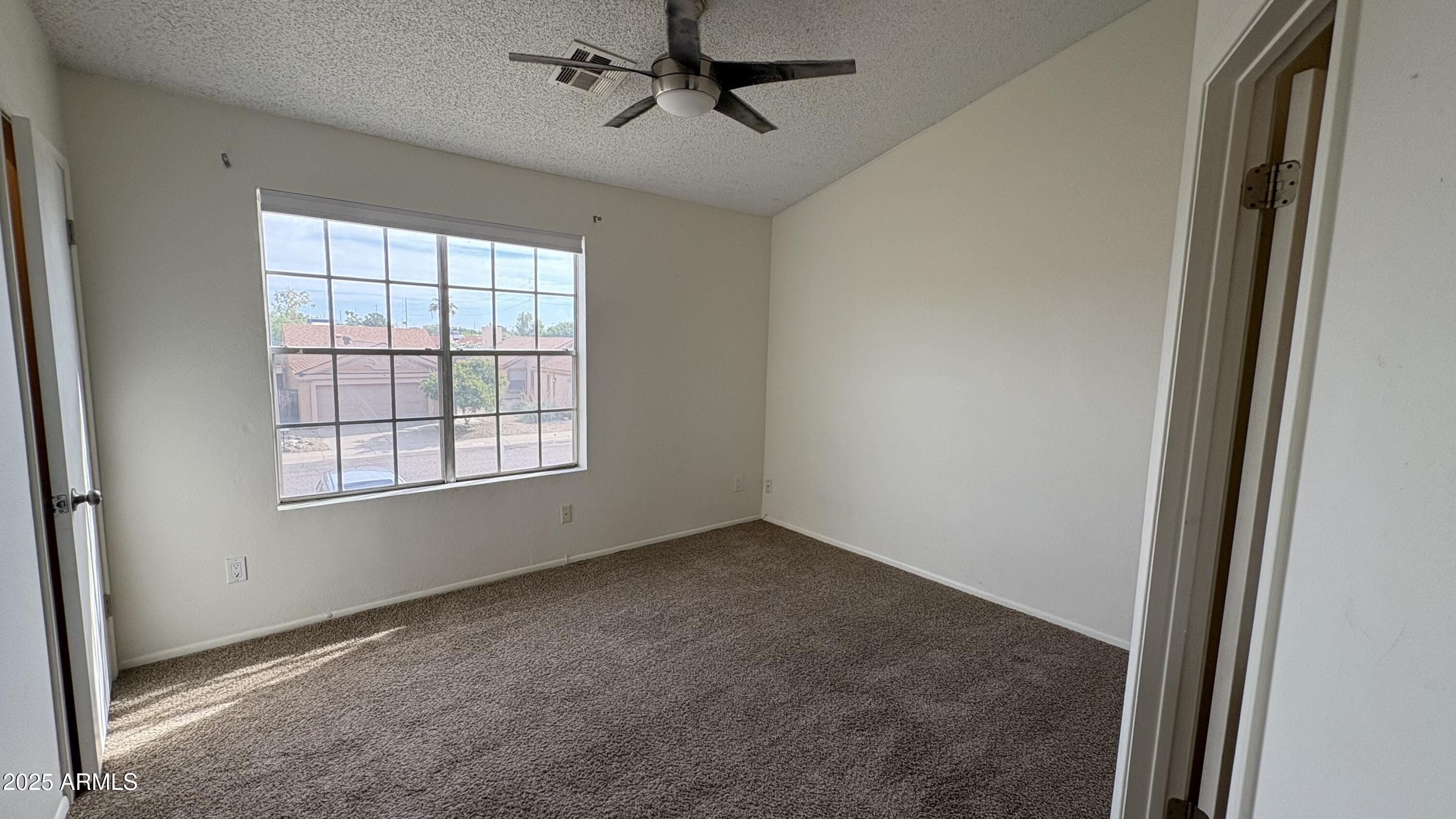 18626 North 33rd Drive, Unit 1 Phoenix, AZ 85027 - Photo 34 of 38 an empty room with windows