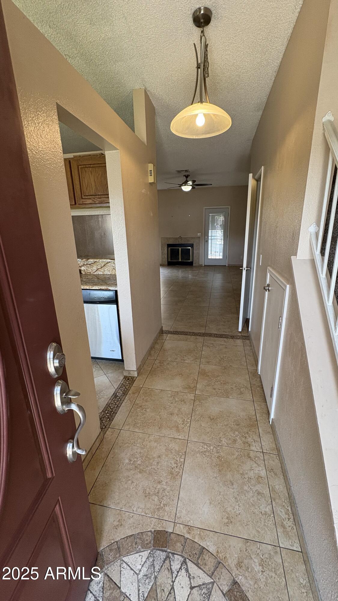 18626 North 33rd Drive, Unit 1 Phoenix, AZ 85027 - Photo 5 of 38 a view of entryway and kitchen