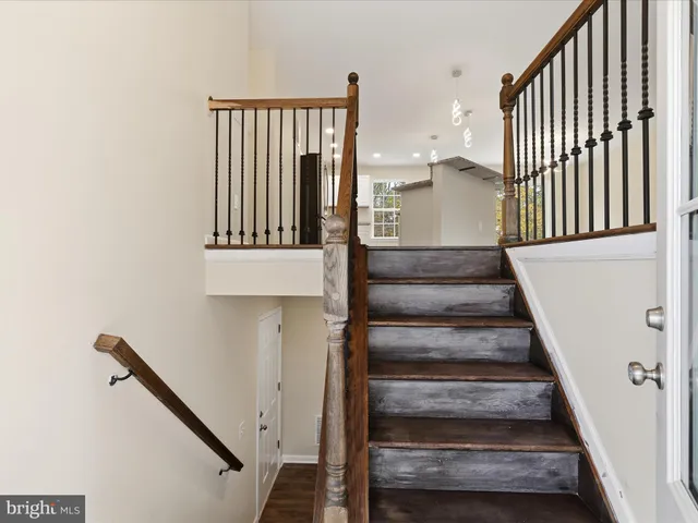 a view of kitchen with furniture and wooden floor