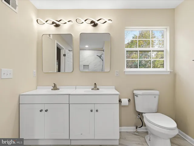 a view of an empty room and wooden floor