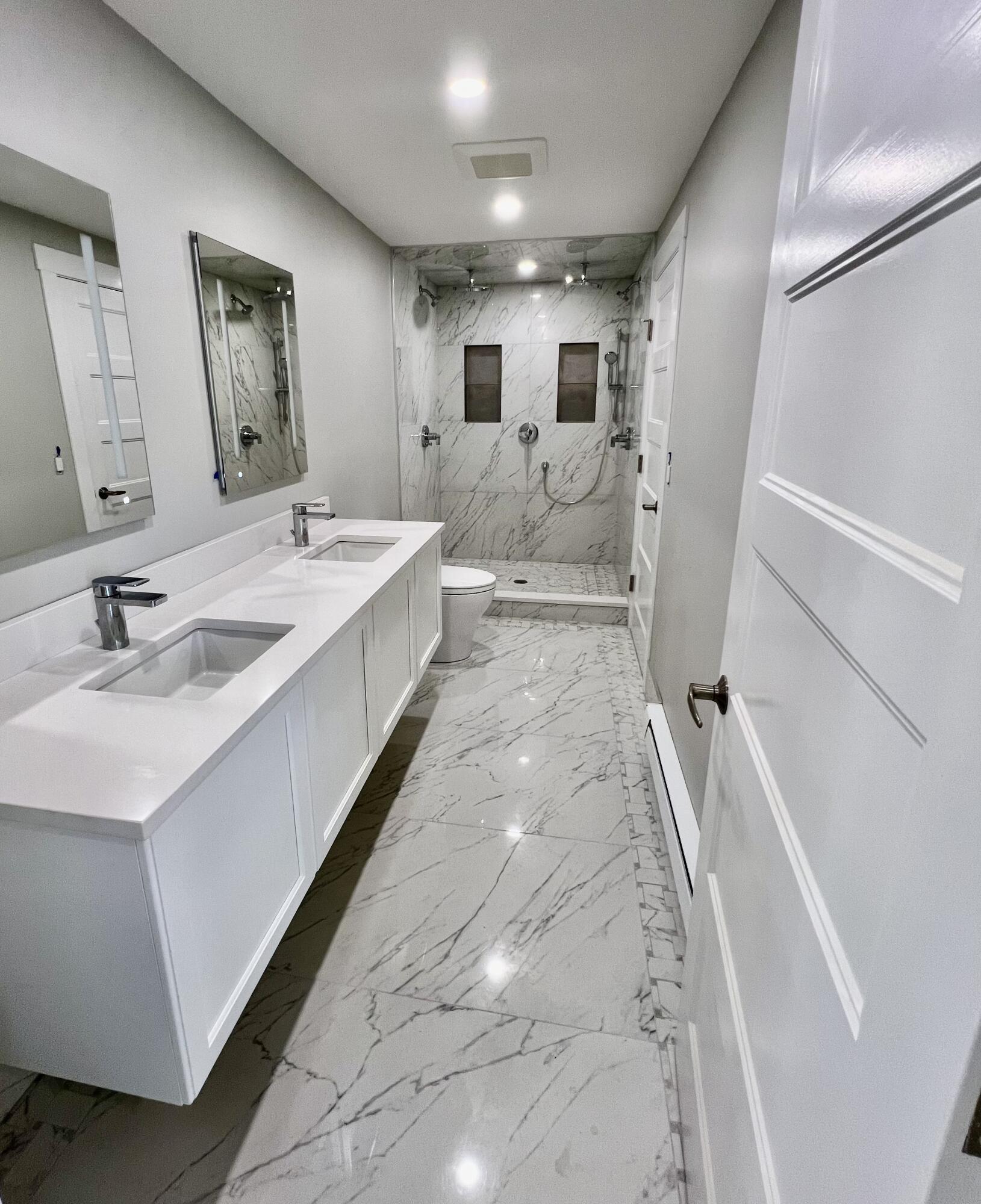 6 Race Road Provincetown, MA 02657 - Photo 24 of 30 a bathroom with a double vanity sink mirror and bathtub