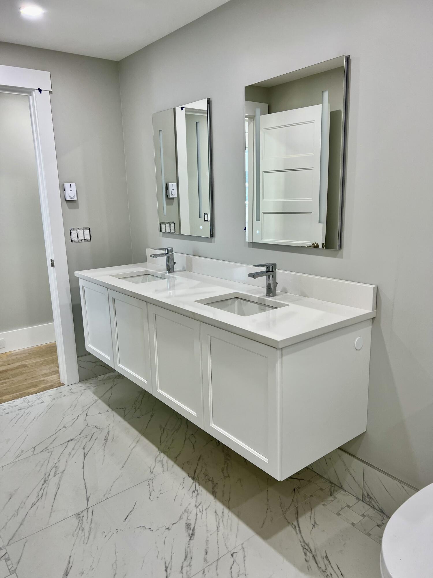 6 Race Road Provincetown, MA 02657 - Photo 25 of 30 a bathroom with a sink and a mirror