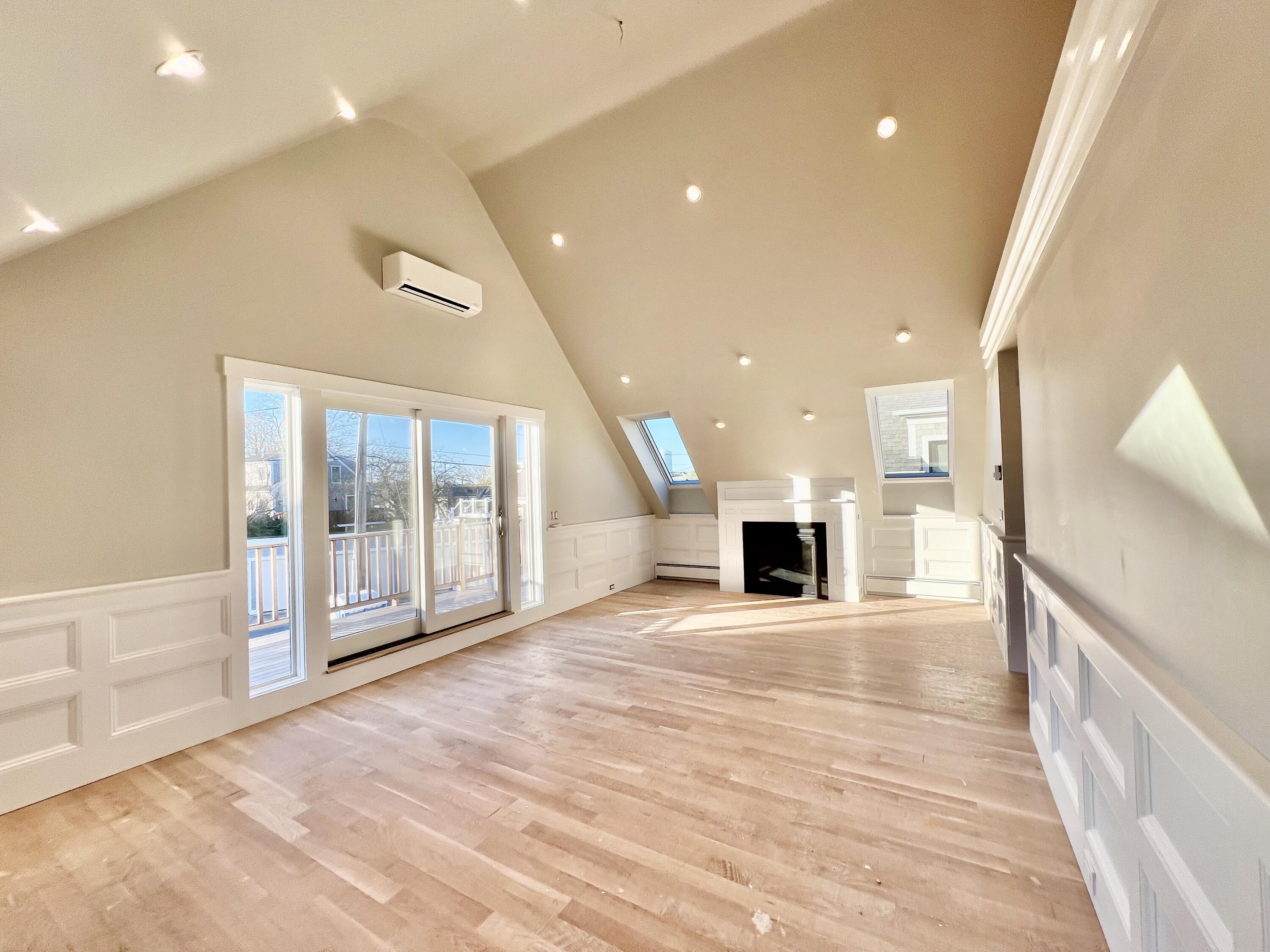 6 Race Road Provincetown, MA 02657 - Photo 3 of 30 a view of a hallway with a livingroom and fireplace