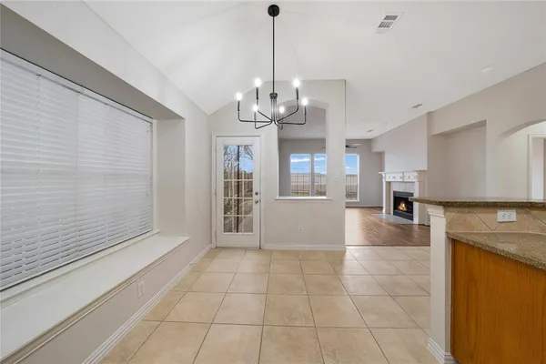 a view of a kitchen with furniture and a kitchen counter top