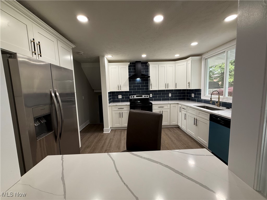 16667 Drake Road Strongsville, OH 44136 - Photo 10 of 30 Kitchen with stainless steel fridge, white cabinets, dark wood-type flooring, recessed lighting, and dishwashing machine