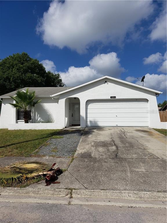 8109 Buttonball Lane Port Richey, FL 34668 - Photo 1 of 1 a view of a parking space in front of a house