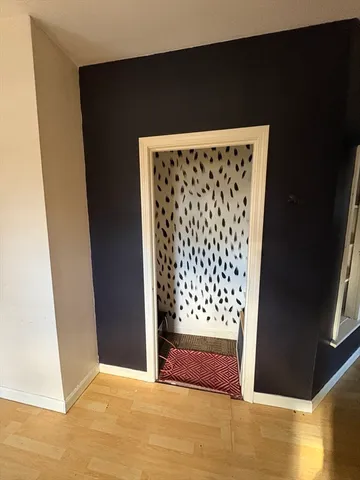 a view of wooden floor in an empty room