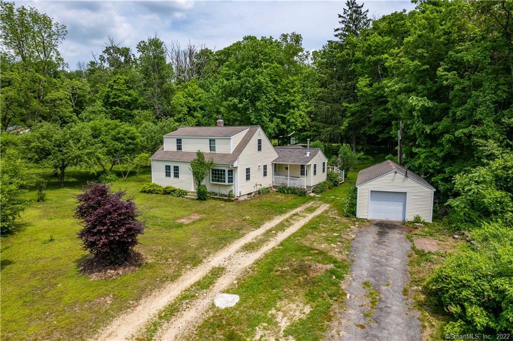 72 Miller Road Chaplin, CT 06235 - Photo 1 of 1 a house with trees in the background