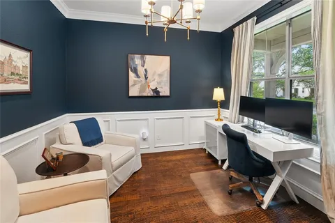 a bedroom with a bed and a desk